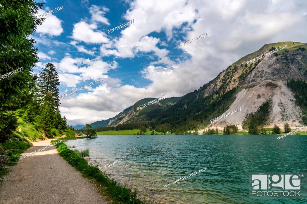 Stock Photo: Adventurous hike around Vilsalpsee to the great Bergaicht waterfall in the Tannheimer Tal.