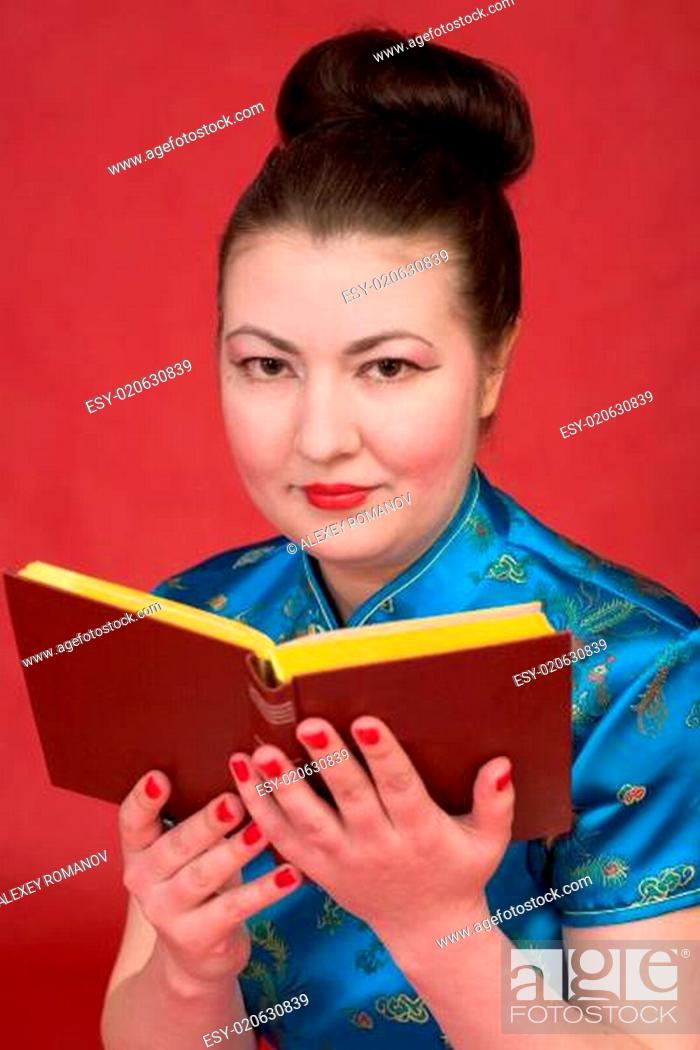 Stock Photo: Japanese girl reading book.