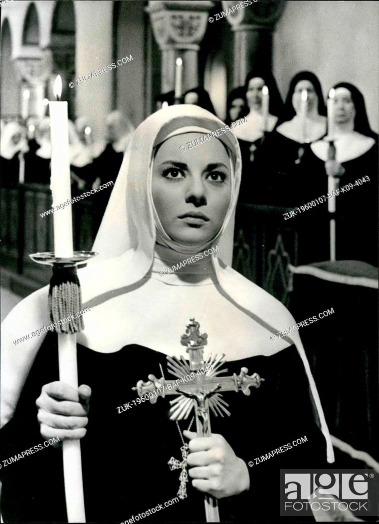 Stock Photo: Feb. 26, 2012 - Candle And Cross clutched in her hands, Sister Virginia kneels before the Archbishop. Giovanna Ralli as the nun in a scene from the Italian film.