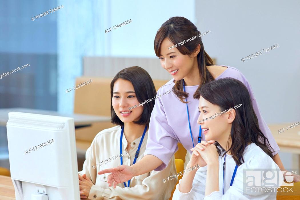 Stock Photo: Japanese businesswomen in the office.