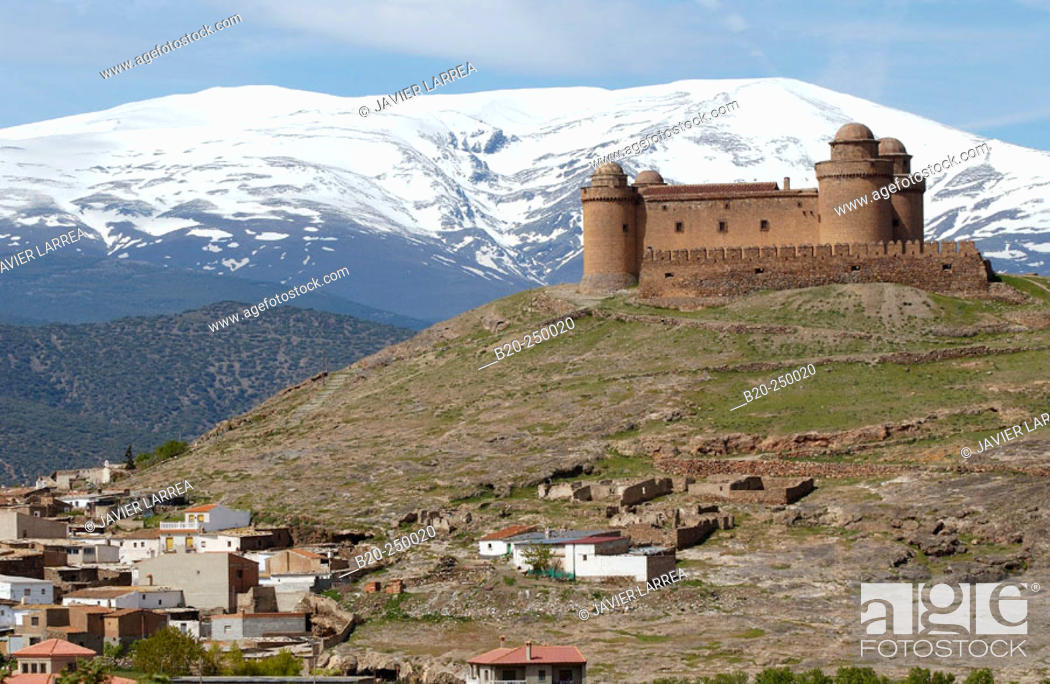 Stock Photo: Lacalahorra Castle and Sierra Nevada mountains. Granada province. Spain.