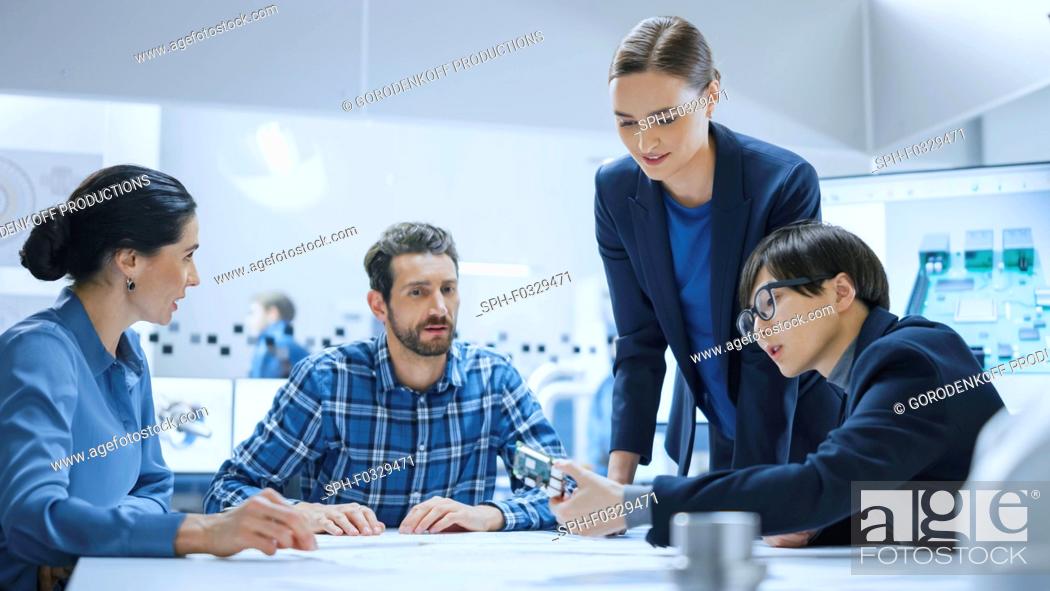 Stock Photo: Team of engineers and specialist talking in a meeting.