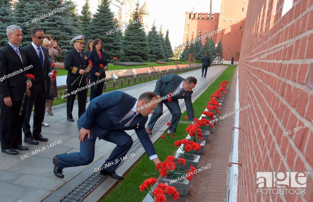 Stock Photo: Expedition 53-54 prime crewmember Alexander Misurkin of Roscosmos (foreground) and his backup and fellow cosmonaut Anton Shkaplerov lay flowers at the Kremlin.