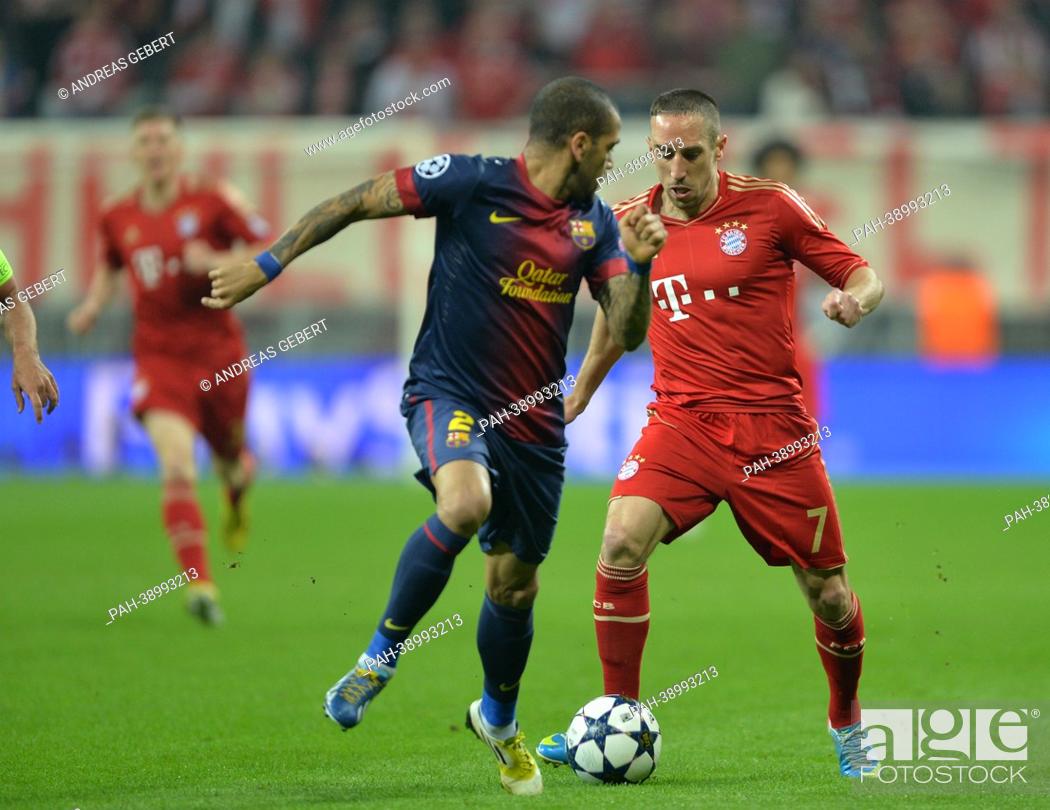 Stock Photo: Munich's Franck Ribery (R) and Barcelona's Daniel Alves vie for the ball during the UEFA Champions League semi final first leg soccer match between FC Bayern.