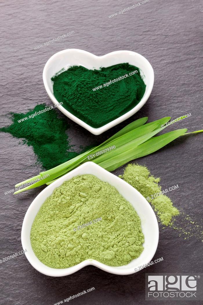 Stock Photo: Healthy chlorella powder and barley grass from top view. Superfood concept. Wheatgrass. Green nutritional supplement detox.