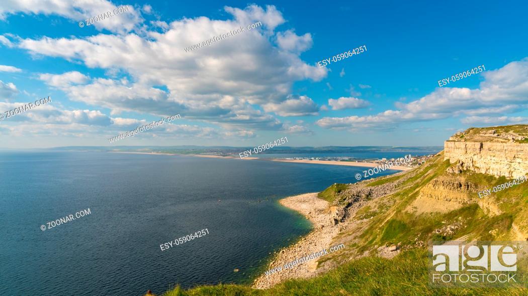 Stock Photo: South West Coast Path on the Isle of Portland, looking towards Fortuneswell and Chesil Beach with Weymouth in the background, Jurassic Coast, Dorset, UK.