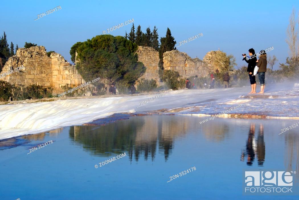 Stock Photo: People, water and wall in Pamukkale, Turkey.