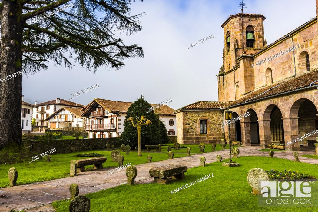 Stock Photo: Church of the Assumption. Around the church you can see the remains of an ancient cemetery with discoid steles cut from stone from the sixteenth century.