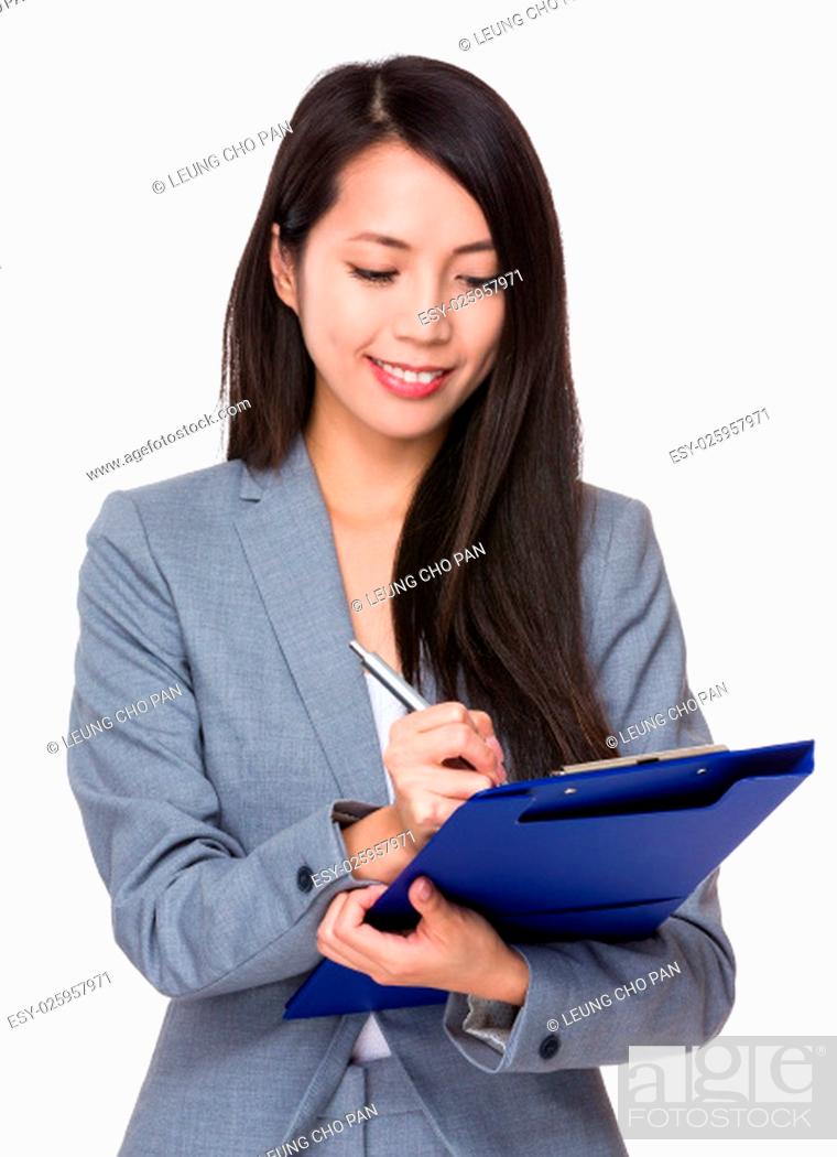 Stock Photo: Young Businesswoman write on clipboard.