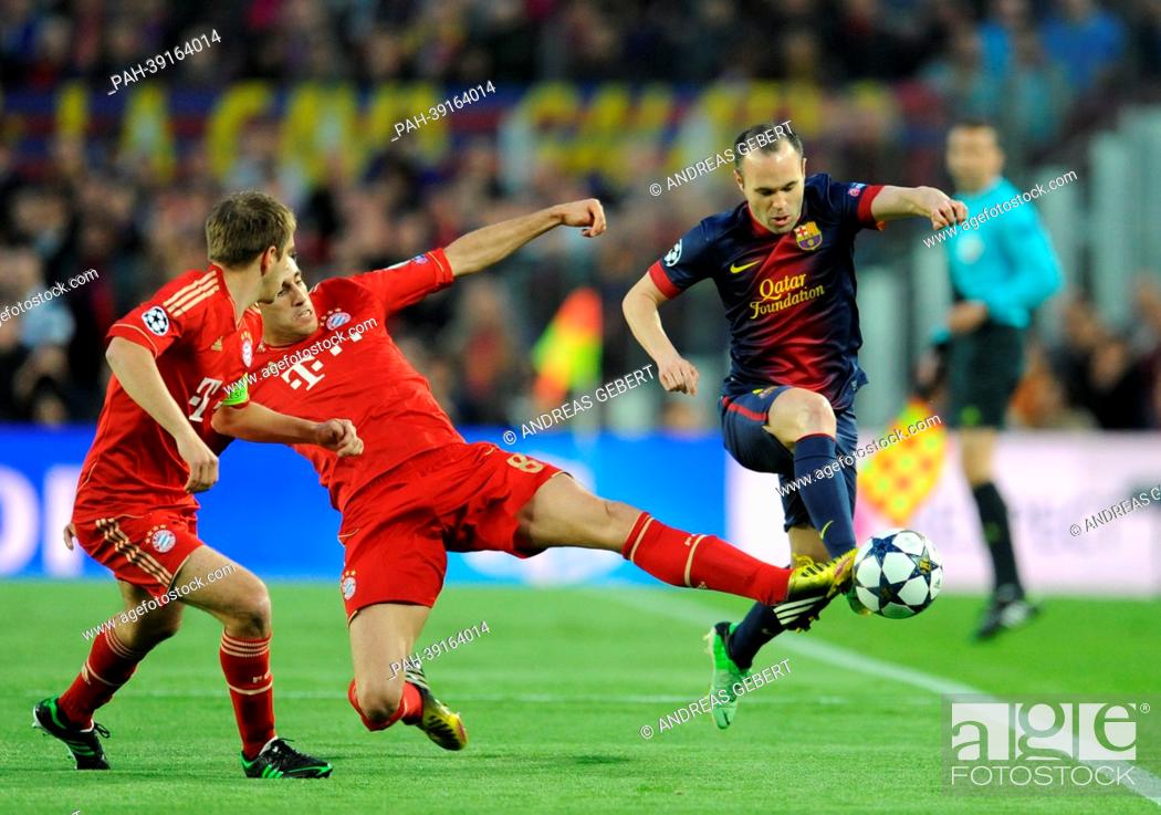 Stock Photo: Barcelona's Andres Iniesta (R) and Munich's Javi Martinez (C) and Philipp Lahm vie for the ball during the UEFA Champions League semi final second leg soccer.