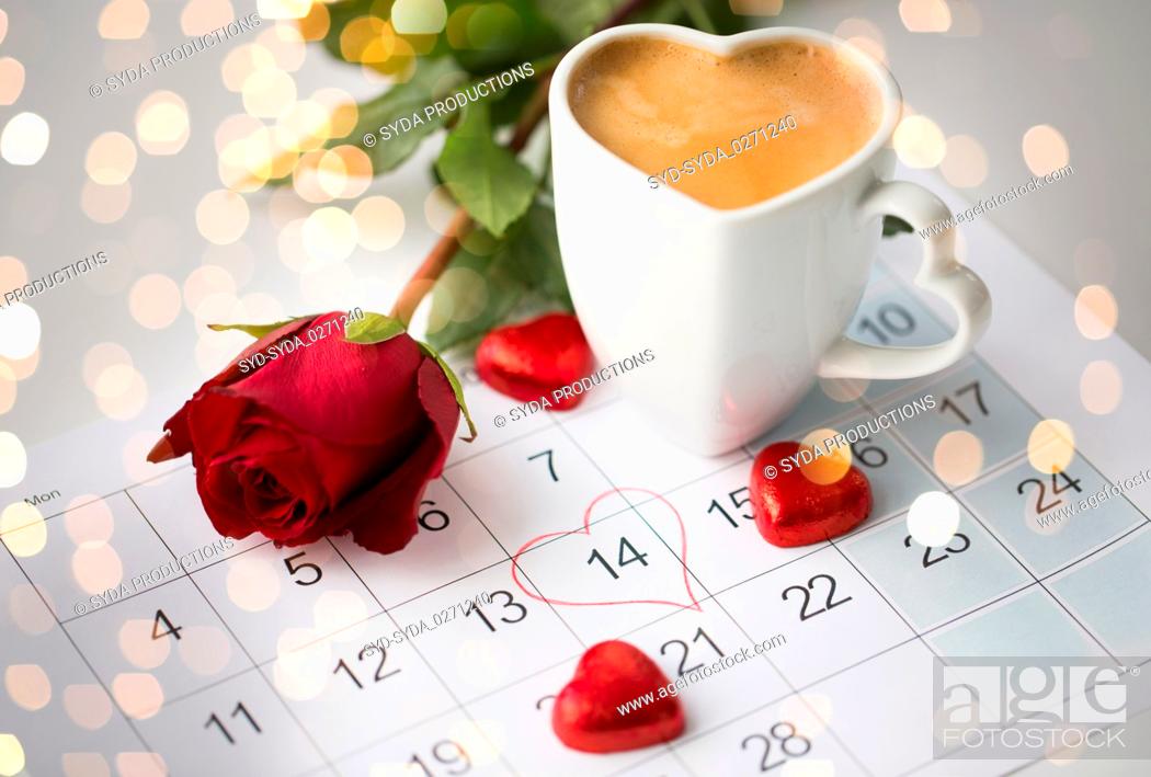 Stock Photo: close up of calendar, hearts, coffee and red rose.