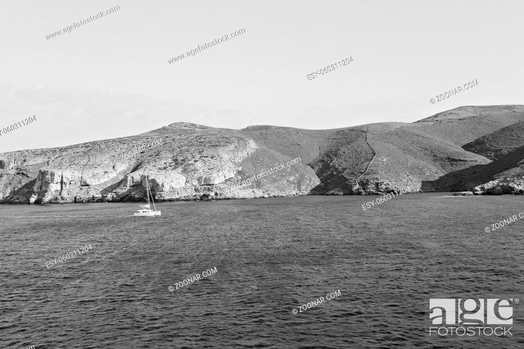 Stock Photo: sailing in europe greece santorini island hill and rocks on the summertime beach.