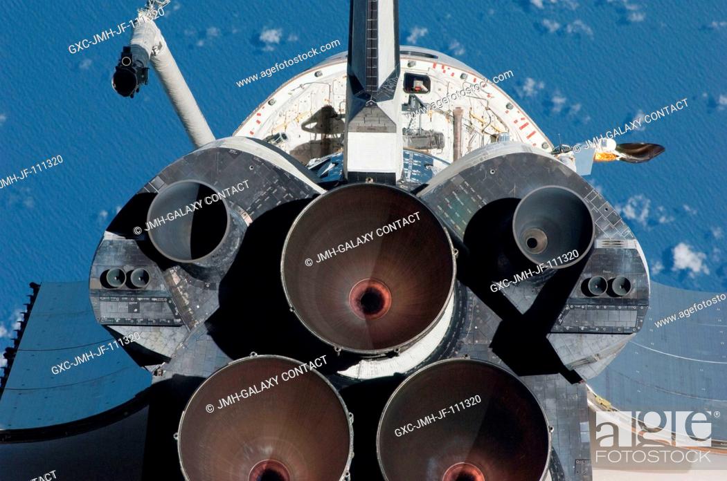 Stock Photo: This view of the aft portion of the space shuttle Endeavour, including the three main engines, was provided by an Expedition 22 crew member during a survey of.