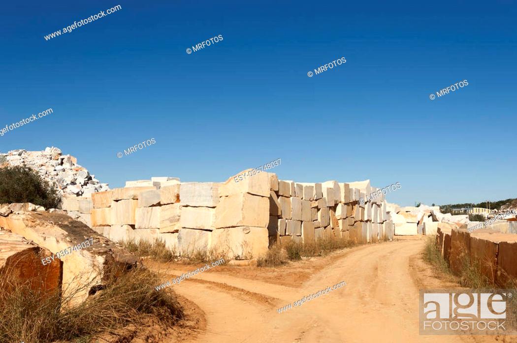 Stock Photo: Marble blocks alongside a dirt road in the marble region of Borba, Alentejo, Portugal.