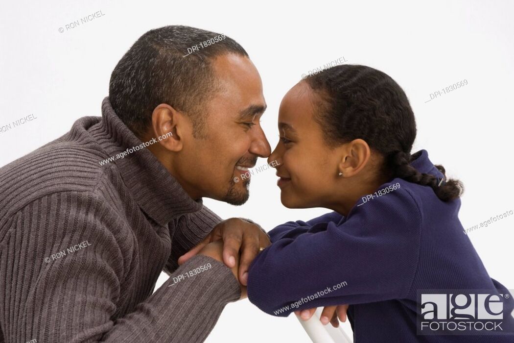Stock Photo: Father and daughter with noses together.