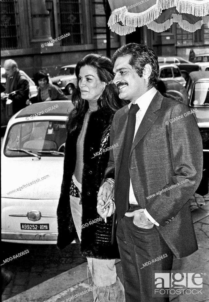 Stock Photo: The Egyptian actor Omar Sharif walking arm in arm with the Brazilian actress Florinda Bolkan in the street after a press conference for the launching of the.