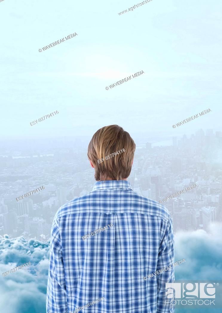 Stock Photo: Man looking across skyline with smoke in front of him.