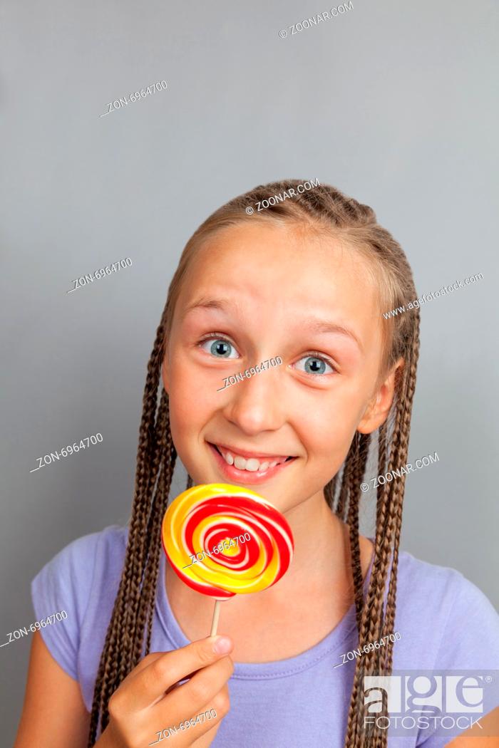 Stock Photo: happy girl woman with lollipop.