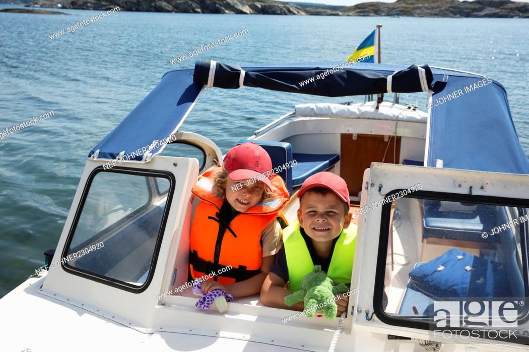 Stock Photo: Kids on boat.