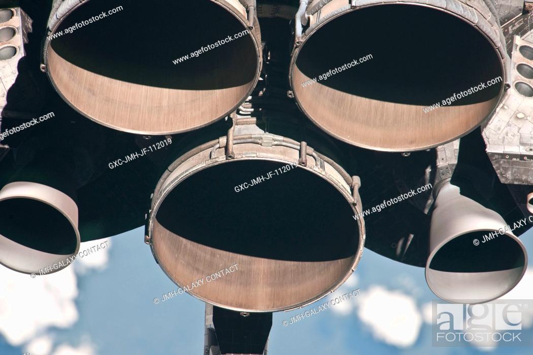 Stock Photo: This partial view of the three main engines of the space shuttle Discovery was provided by an Expedition 26 crew member during a survey of the approaching.