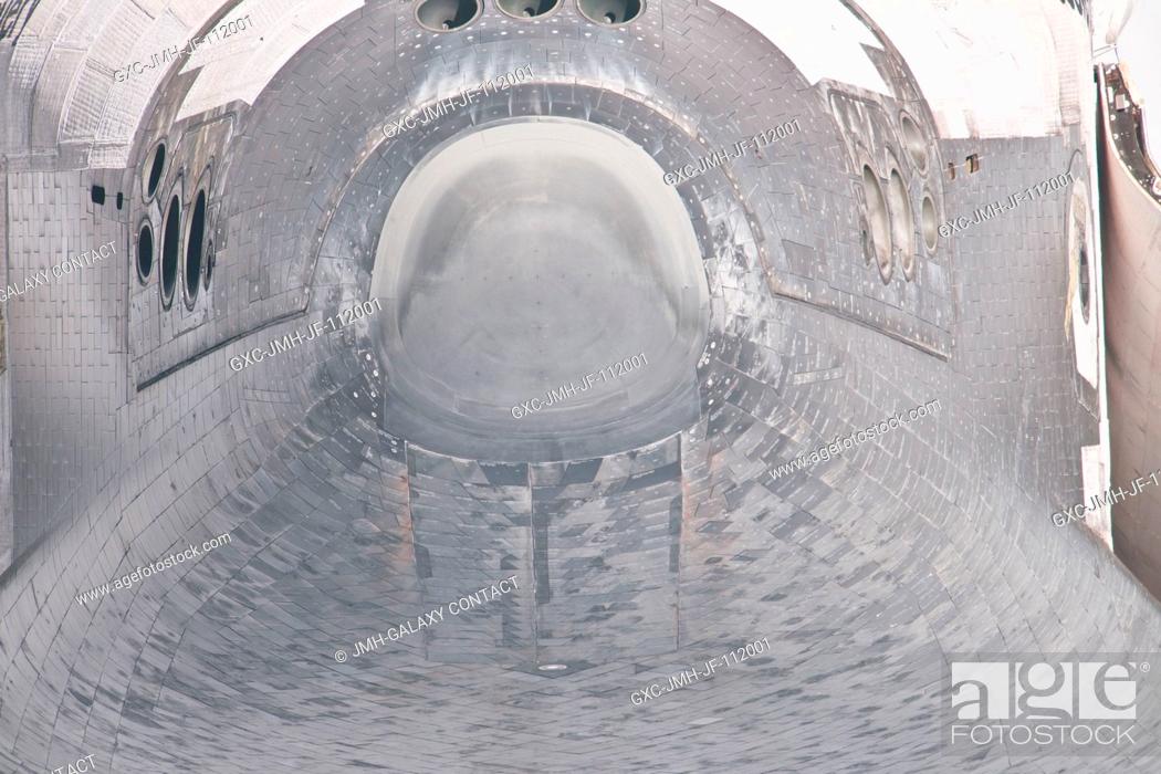 Stock Photo: This unique view of the nose and forward underside of the space shuttle Discovery was provided by an Expedition 26 crew member during a survey of the.