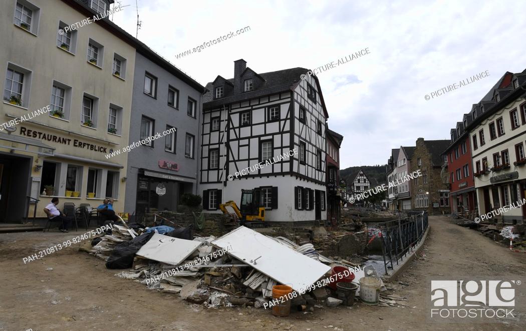 Stock Photo: 12 August 2021, North Rhine-Westphalia, Bad Münstereifel: Debris still lies in the streets of the Eifel village a month after the flood disaster.