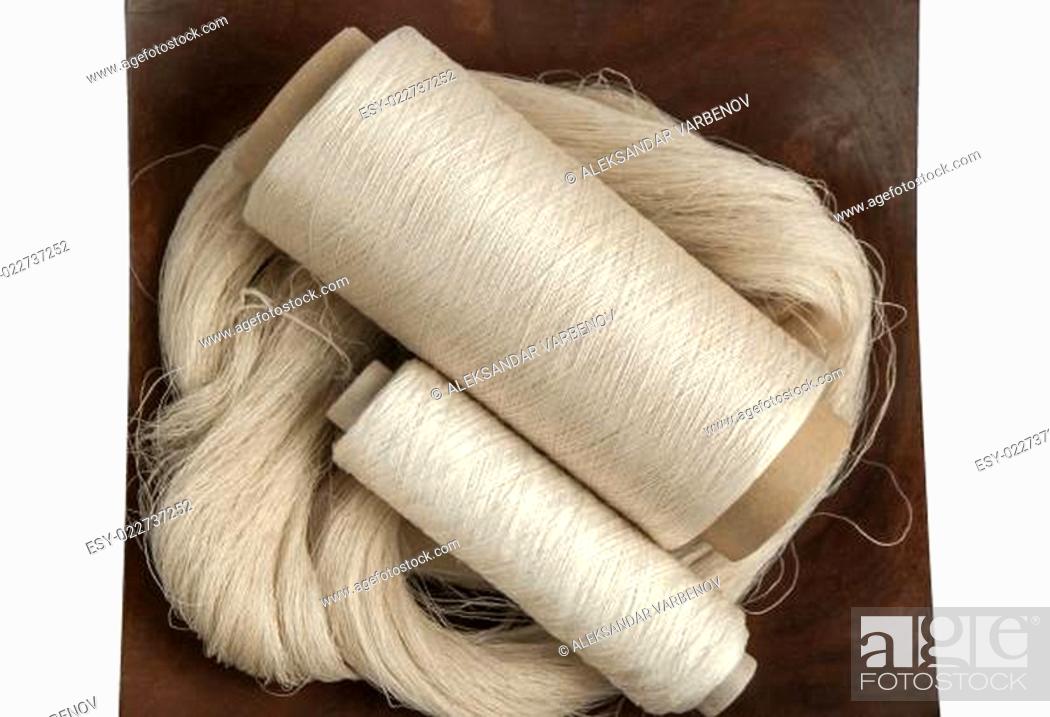 Stock Photo: Silk yarn skein and bobbins.