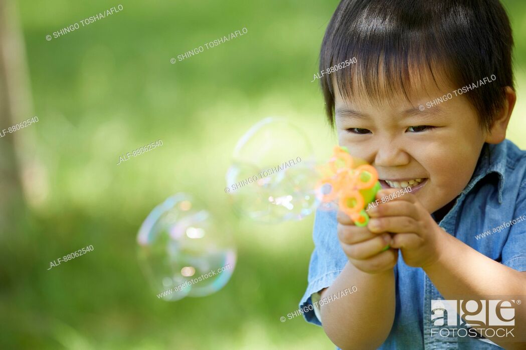 Stock Photo: Japanese kid in a city park.