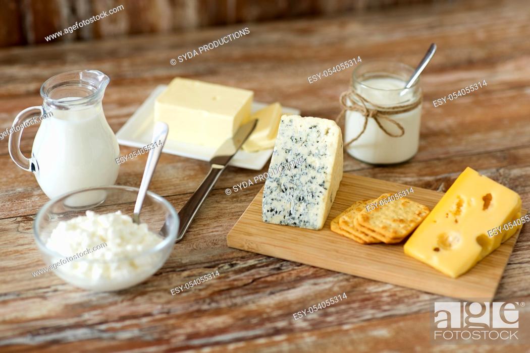 Stock Photo: cottage cheese, crackers, milk, yogurt and butter.