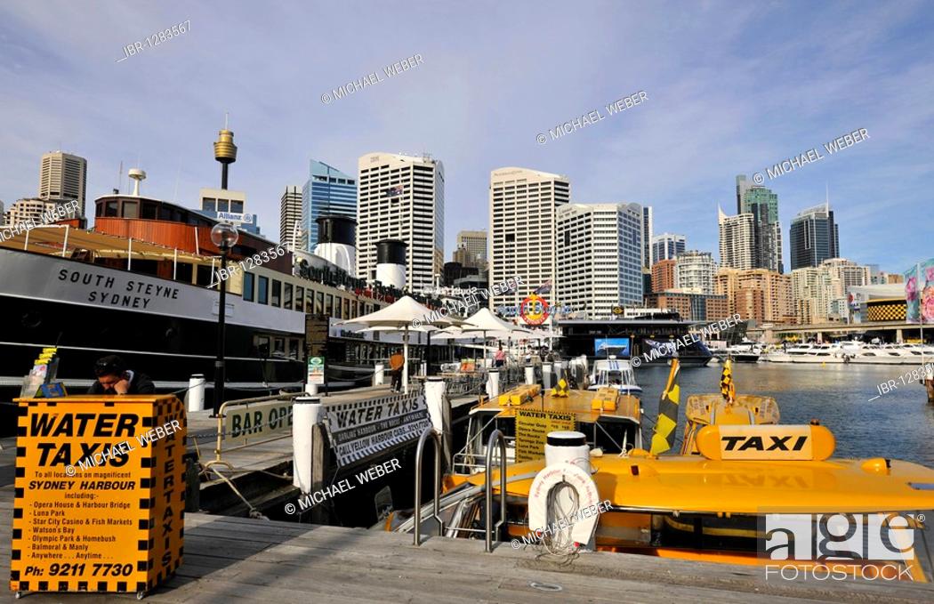 Stock Photo: Water taxis in Darling Harbour in front of Sydney Tower or Centrepoint Tower and the skyline of the Central Business District, Sydney, New South Wales.