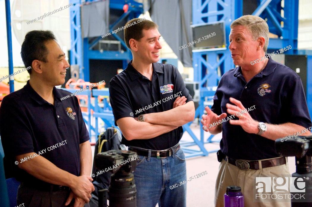 Stock Photo: NASA astronaut Mike Fossum (right), Expedition 28 flight engineer and Expedition 29 commander; along with Russian cosmonaut Sergei Volkov (center) and Japan.
