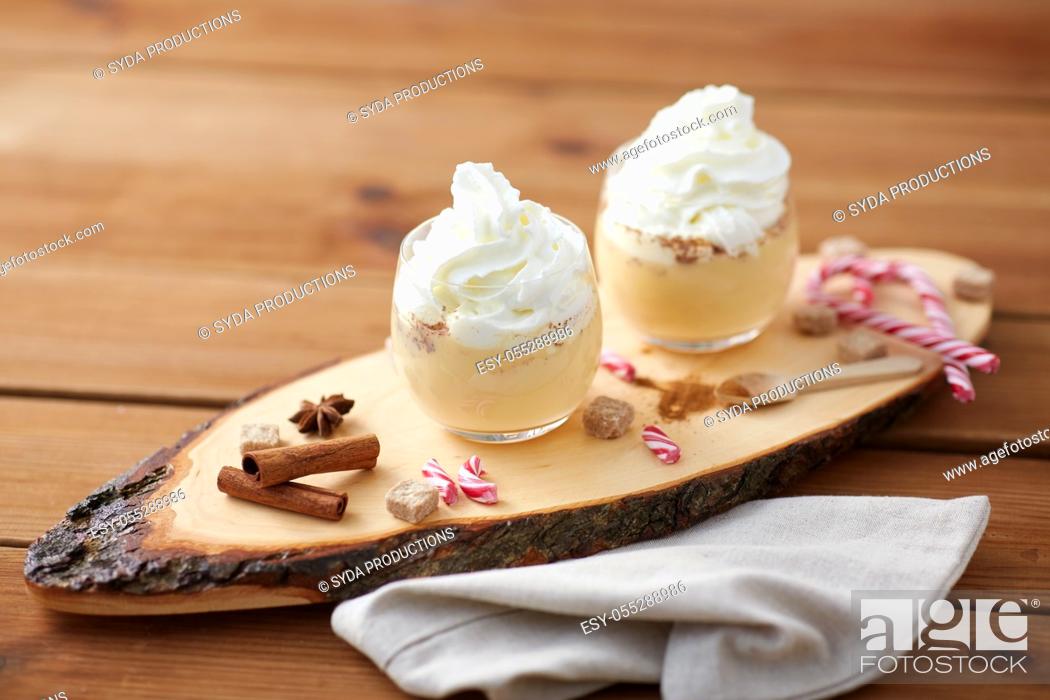 Stock Photo: glasses of eggnog with whipped cream and anise.