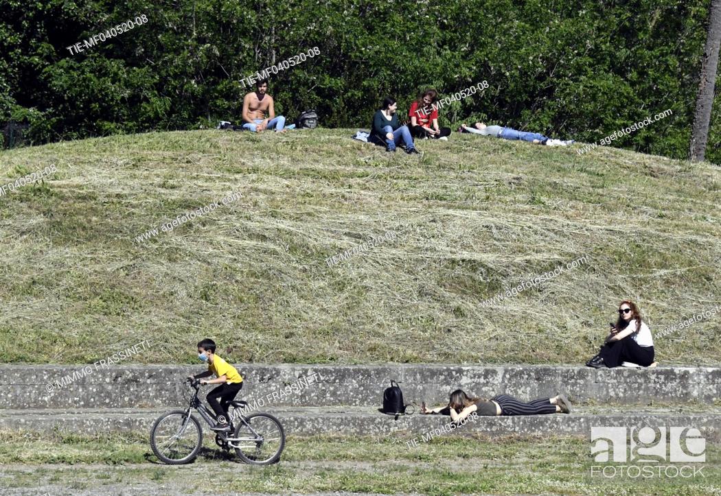 Stock Photo: People in Villa Torlonia reopening in the phase 2 Coronavirus emergency, is allowed physical activity and outdoor life, keeping safety distances , Rome.