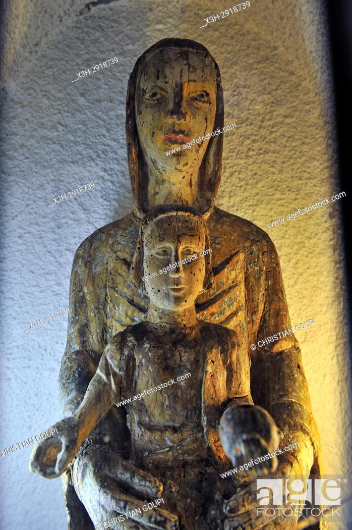 Stock Photo: statue of Our Lady from 13 th century inside the Romanesque Church of Lisseuil, Puy-de-Dome department, Auvergne-Rhone-Alpes region, France, Europe.