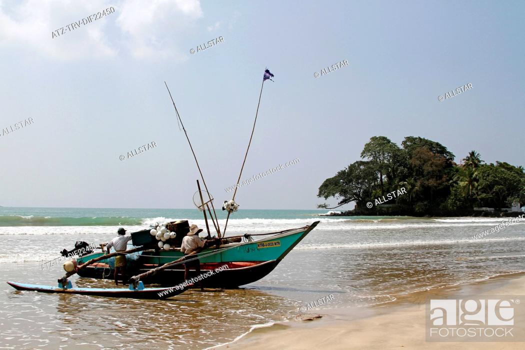 Stock Photo: FISHING BOAT & TAPROBANE ISLAND; WELIGAMA, SRI LANKA, ASIA; 18/03/2013.