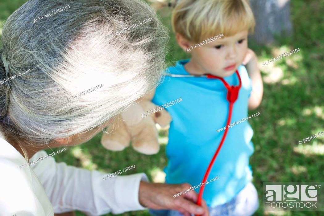Stock Photo: Little girl and grandmother, cropped.