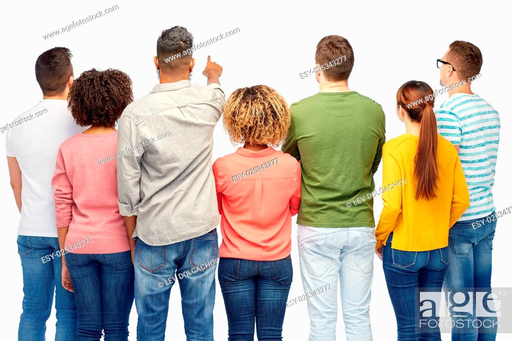 Stock Photo: diversity, race, ethnicity and people concept - international group of happy smiling men and women pointing finger to something over white.