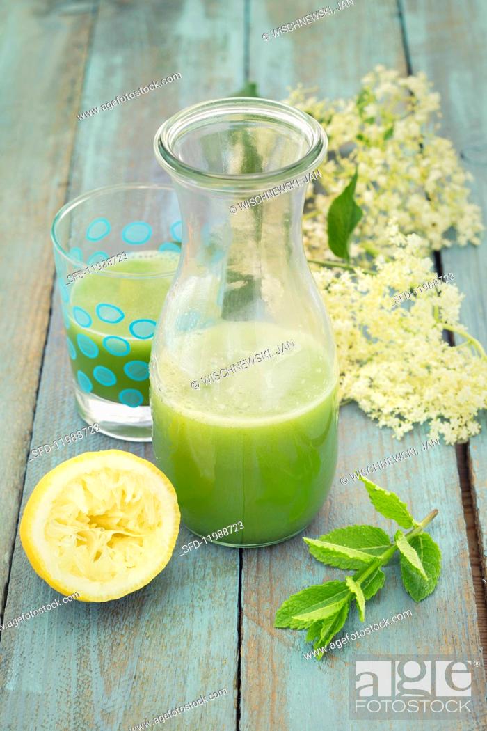 Stock Photo: Detox cucumber lemonade with elderflower syrup and mint.