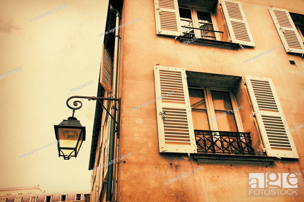 Stock Photo: Old, Parisian historic house with an old street lamp in vintage style.