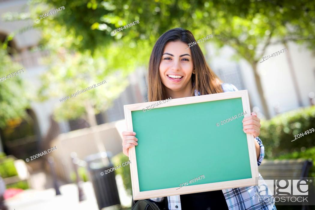 Stock Photo: Portrait of An Attractive Excited Mixed Race Female Student Holding Blank Chalkboard and Carrying Backpack on School Campus.