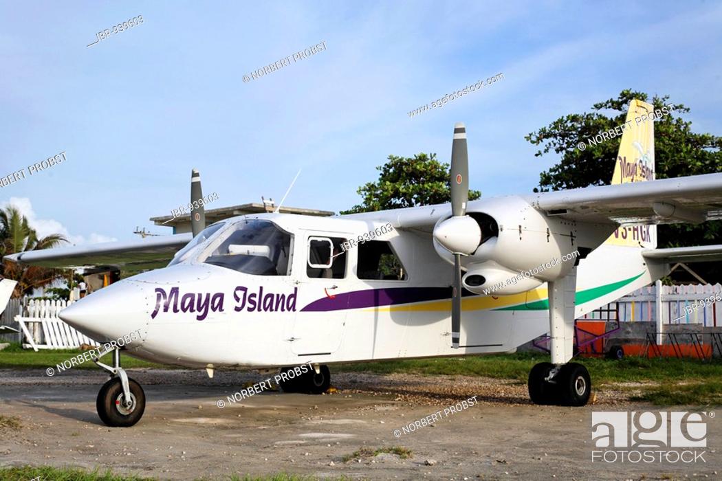 Stock Photo: Twin engine plane, a Britten Norman BN2 Islander, Maya Island Air, at the local airport of San Pedro, Ambergris Cay Island, Belize, Central America, Caribbean.