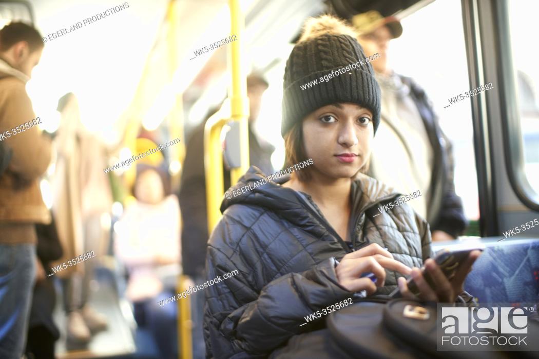 Stock Photo: Young woman in bus.