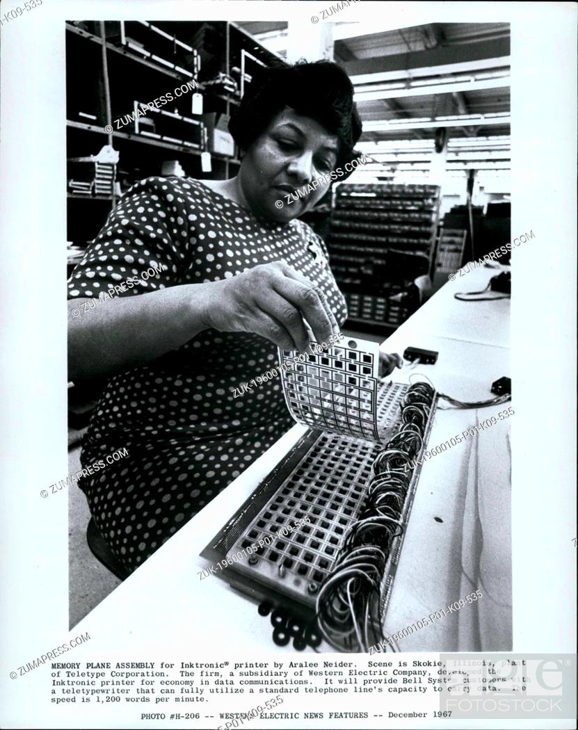 Stock Photo: 1968 - Blocked by grey box Memory Plane Assembly for Inktronic; printer by Aralee Neider. Scene in Skokie, Illinois, plant of teletype corporation.