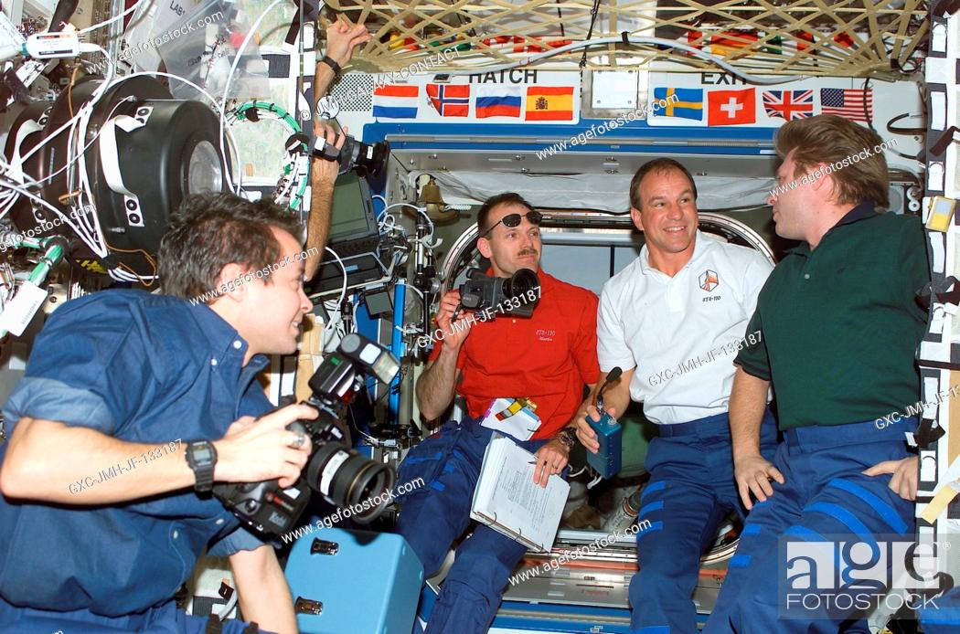 Stock Photo: Astronaut Daniel W. Bursch (left), Expedition Four flight engineer; astronauts Steven L. Smith and Michael J. Bloomfield.