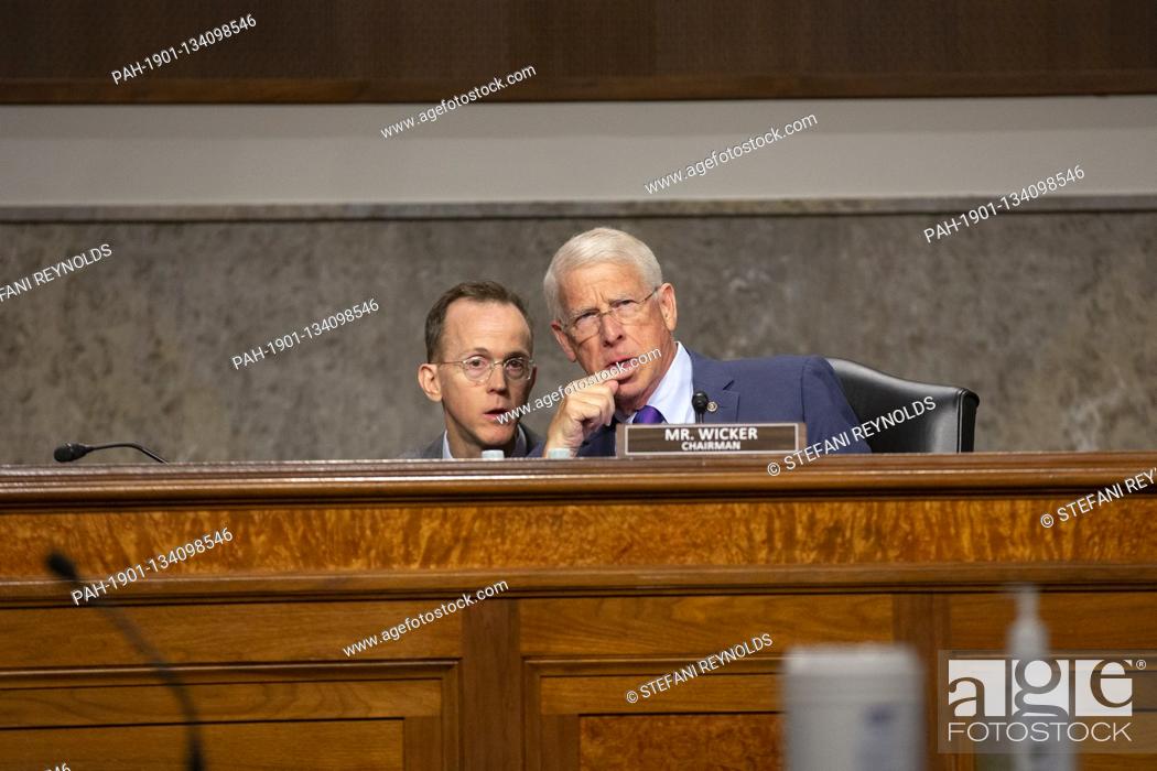 Stock Photo: United States Senator Roger Wicker (Republican of Mississippi) speaks to a staff member during a Senate Committee on Commerce, Science.