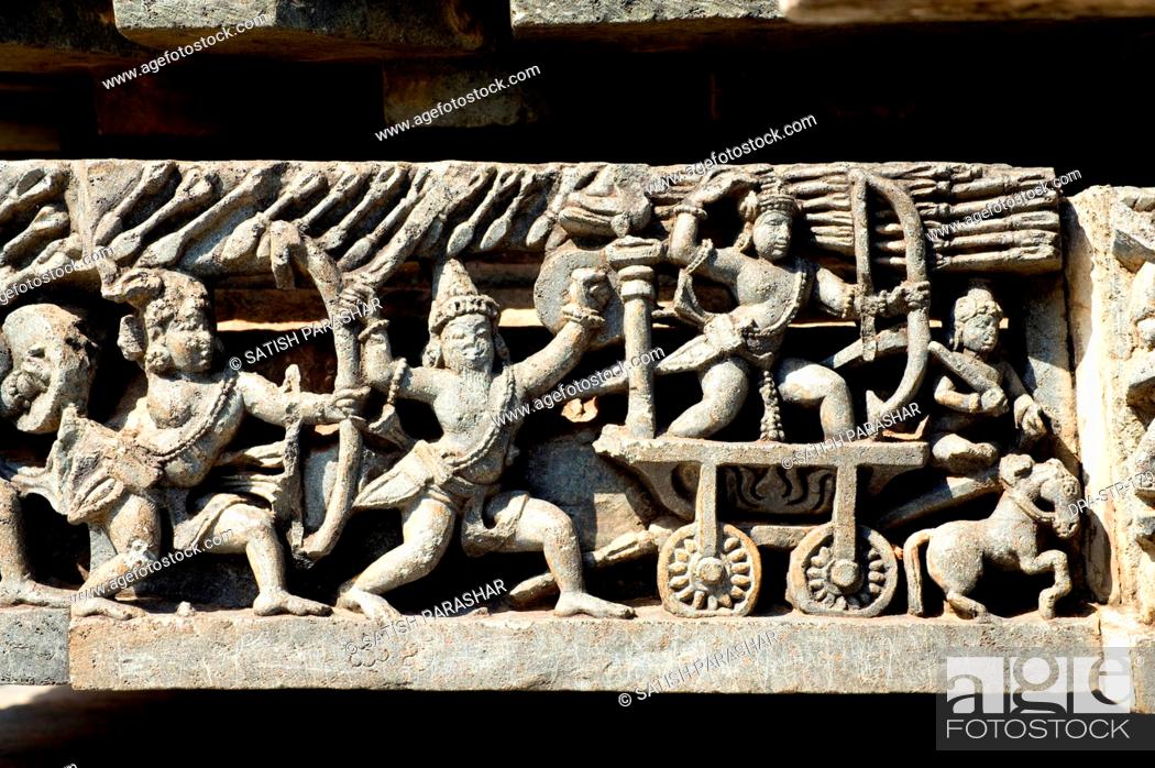 Stock Photo: War scene carved on wall of hoysaleswara temple ; Halebid Halebidu ; Hassan ; Karnataka ; India.