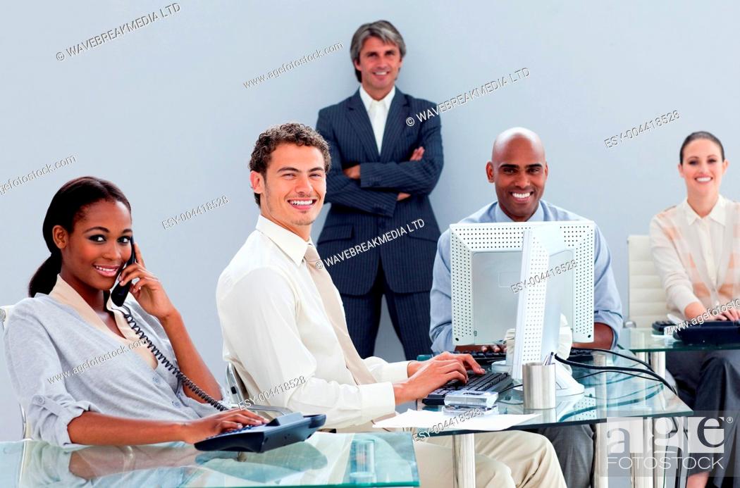 Stock Photo: Portrait of a multi-ethnic business team at work.
