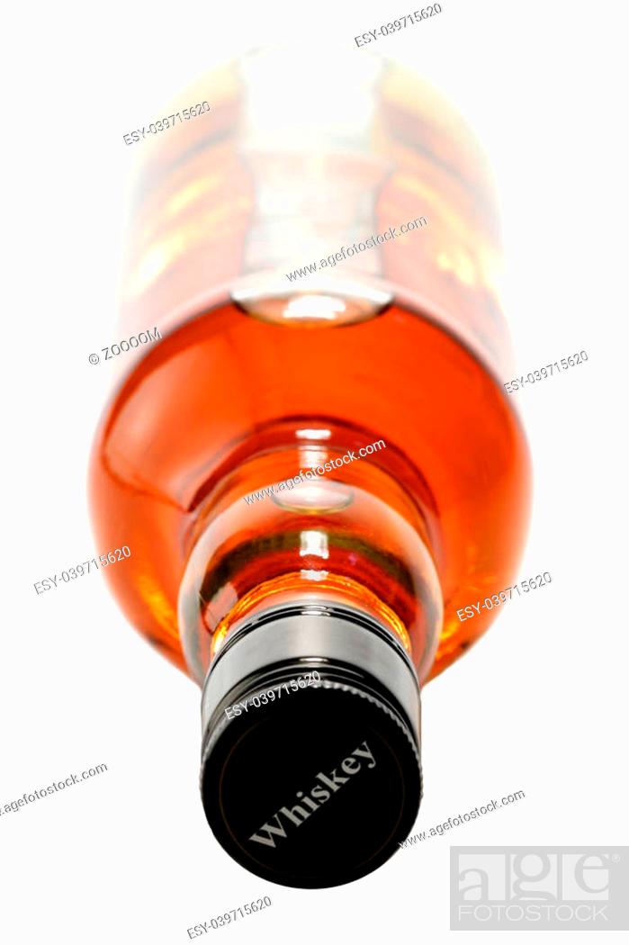 Stock Photo: Whiskey bottle isolated over a whte background, focus on the bottle neck.