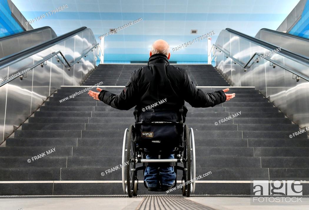 Stock Photo: Illustration: a wheelchair user standing in front of stairs, Germany, city of Hamburg, 05. March 2019. Photo: Frank May (model released) | usage worldwide.