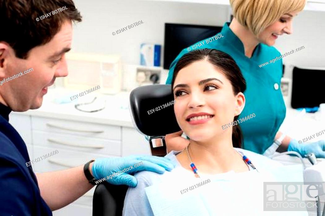 Photo de stock: Dentist advice his female patient after treatment.